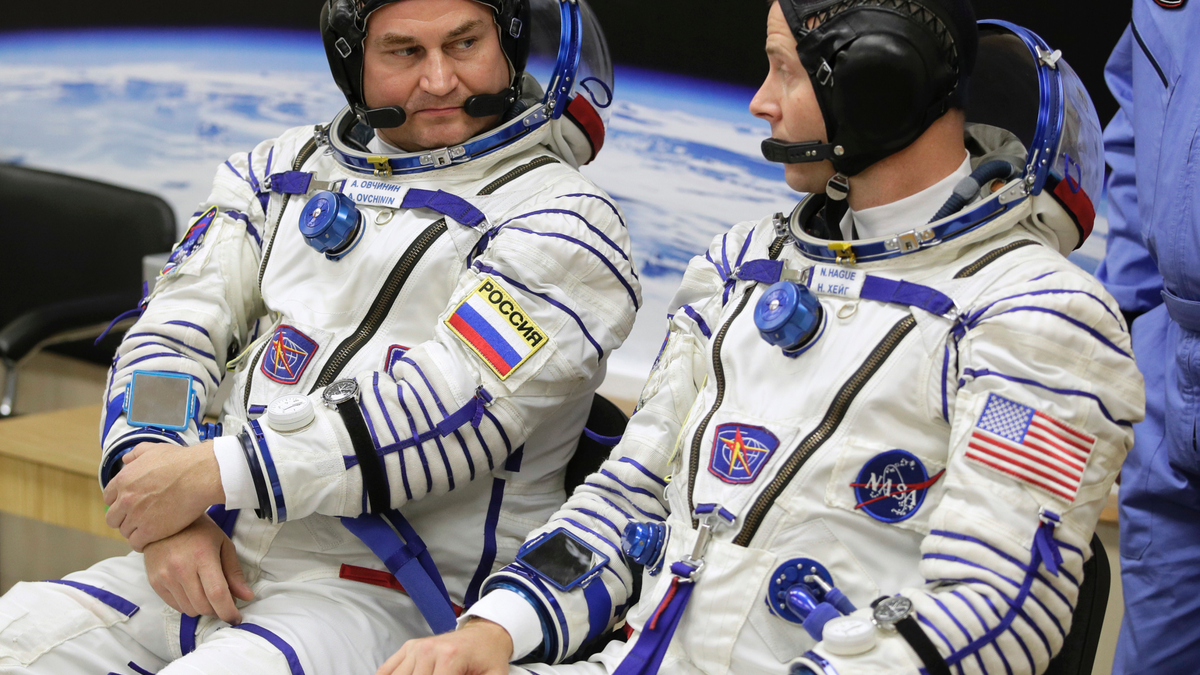 U.S. astronaut Nick Hague, right and Russian cosmonaut Alexey Ovchinin, member of the main crew of the expedition to the International Space Station (ISS), speak prior to the launch of Soyuz MS-10 space ship at the Russian leased Baikonur cosmodrome, Kazakhstan, Thursday, Oct. 11, 2018. (AP Photo/Dmitri Lovetsky)