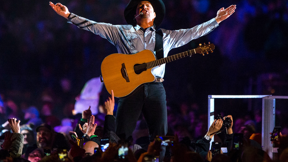 In an Oct. 20, 2018 file photo, Garth Brooks performs before a sold-out crowd at Notre Dame Stadium, in South Bend, Ind.