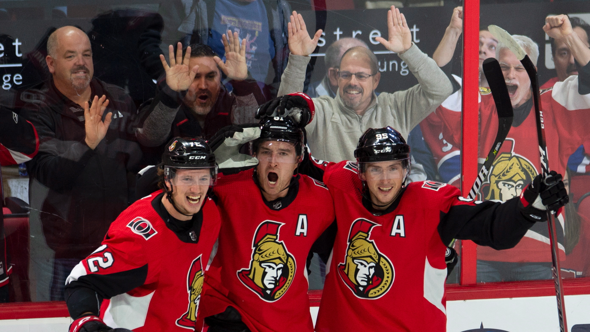 Ottawa Senators right wing Mark Stone celebrates his game-winning goal with teammates Thomas Chabot (72) and center Matt Duchene (95) during overtime of an NHL game in Ottawa, Ontario, Saturday, Oct. 20, 2018. A Senators player has tested positive for the coronavirus, according to a team statement Tuesday night. It's the first known case in the NHL so far.<br data-cke-eol="1">
(Adrian Wyld/The Canadian Press via AP)
