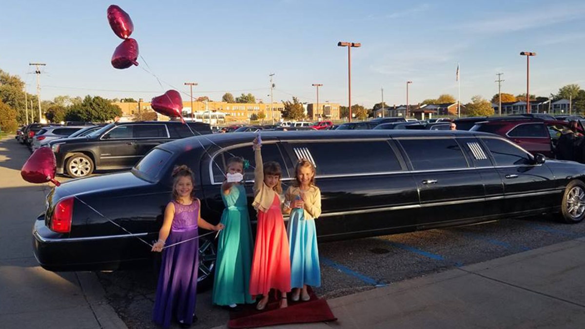 Aliyah Culbert, Hailey Culbert, Alivia Reece and Avery Recee in front of the limousine.