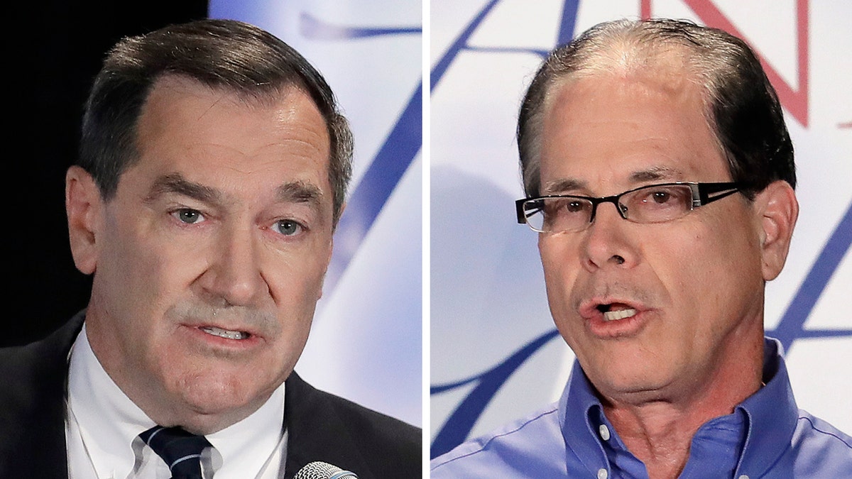 FILE - This combination of Oct. 8, 2018, file photos show Indiana U.S. Senate candidates, Democratic Sen. Joe Donnelly, left, and former Republican state Rep. Mike Braun during a debate in Westville, Ind. (AP Photo/Darron Cummings, File)