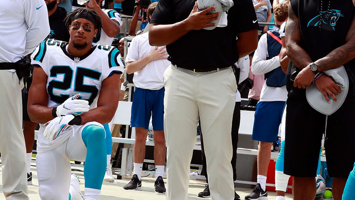 Carolina Panthers' Eric Reid (25) kneels during the national anthem before an NFL football game against the New York Giants in Charlotte, N.C., Sunday, Oct. 7, 2018. (AP Photo/Jason E. Miczek)