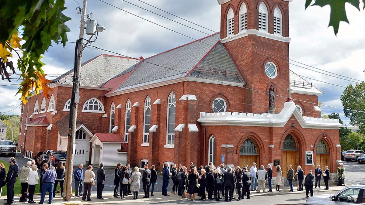 Mourners enter St. Stanislaus Roman Catholic Church to attend calling hours for Schoharie limo crash victims; Abigail (King) Jackson, Adam "Action" Jackson, Mary (King) Dyson, Robert J. Dyson, Allison A. King, Amy (King) Steenburg, Axel J. Steenburg and Richard Steenburg Jr., on Friday Oct. 12, 2018, in Amsterdam, N.Y. (John Carl D'Annibale/The Albany Times Union via AP)