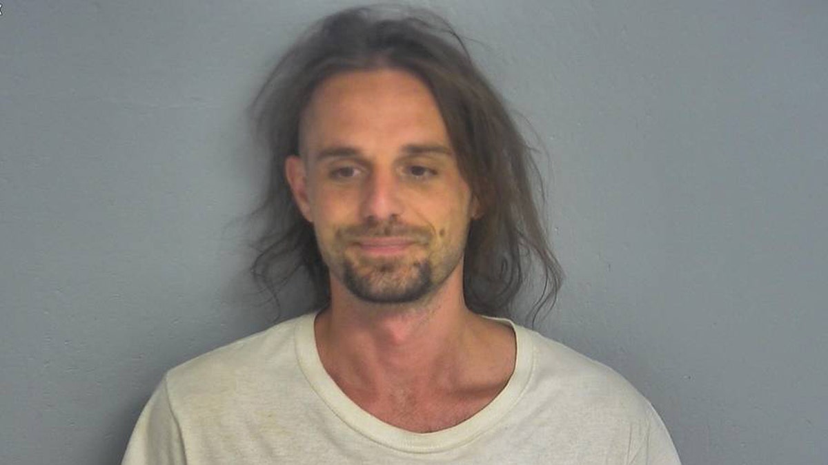 Dustin Burns, 33, is charged with a felony after recording a video of himself removing his ankle monitor, officials said. 