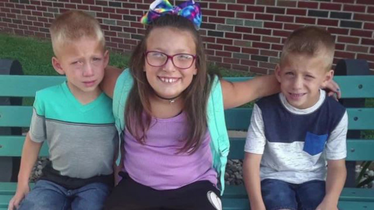 This undated family photo provided by Elgin Ingle shows Alivia Stahl, center, and her twin brothers, Xzavier and Mason Ingle.