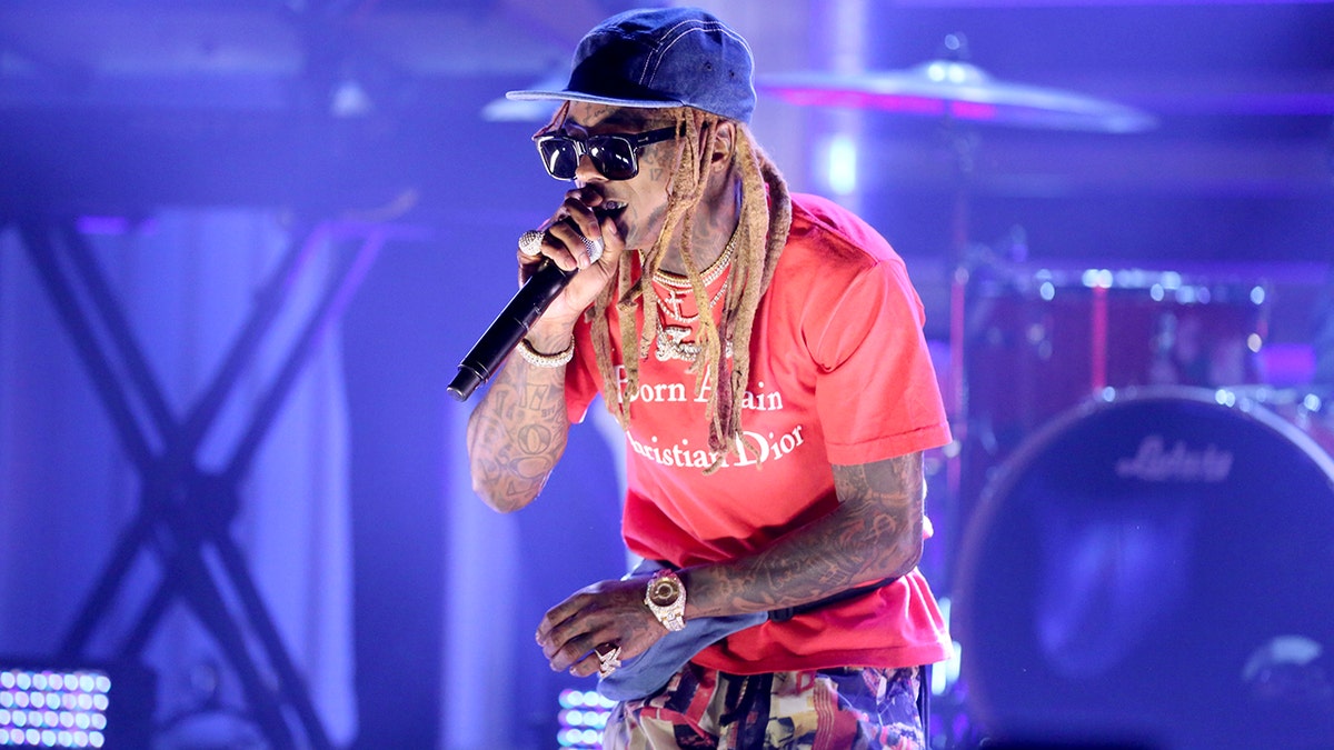 Lil Wayne, pictured here performing on 'The Tonight Show,' recently ended a concert after false reports of gunshots panicked the crowd.