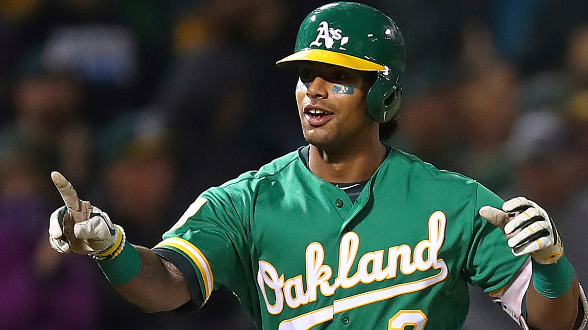 Oakland Athletics' Khris Davis celebrates after hitting a walk-off home run in the 10th inning of a baseball game against the Minnesota Twins.
