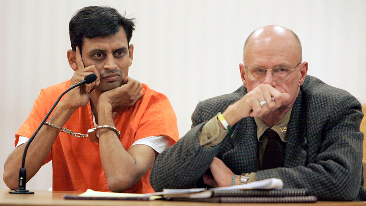 Manishkumar Patel, left, sits with his attorney during his initial court appearance at the Outagamie County Justice Center in Appleton, Wis., Nov. 29, 2007.