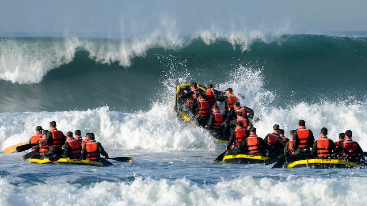 Students participate in the Navy Basic Underwater Demolition course during an evolution, which is part of Navy SEAL training, known as "surf passage" on Amphibious Base Coronado, Calif.