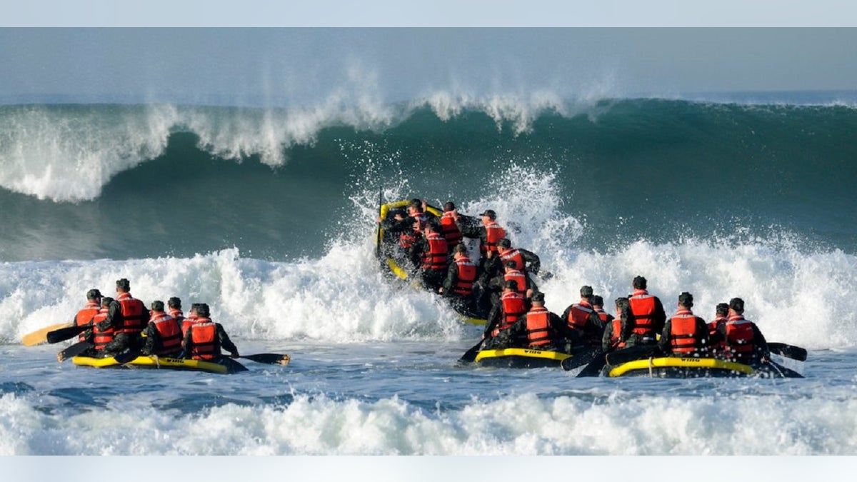 Students participate in the Navy Basic Underwater Demolition course during an evolution, which is part of Navy SEAL training, known as "surf passage" on Amphibious Base Coronado, Calif.