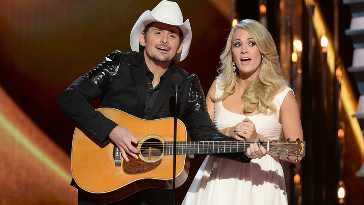 Brad Paisley and Carrie Underwood at the 2014 CMAs. 