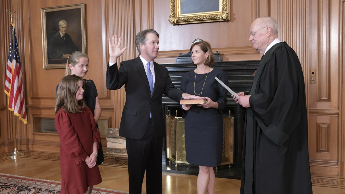 Justice Anthony M. Kennedy, (Retired) administers the Judicial Oath to Judge Brett M. Kavanaugh in the Justices’ Conference Room, Supreme Court Building. Mrs. Ashley Kavanaugh holds the Bible. Credit: Fred Schilling, Collection of the Supreme Court of the United States