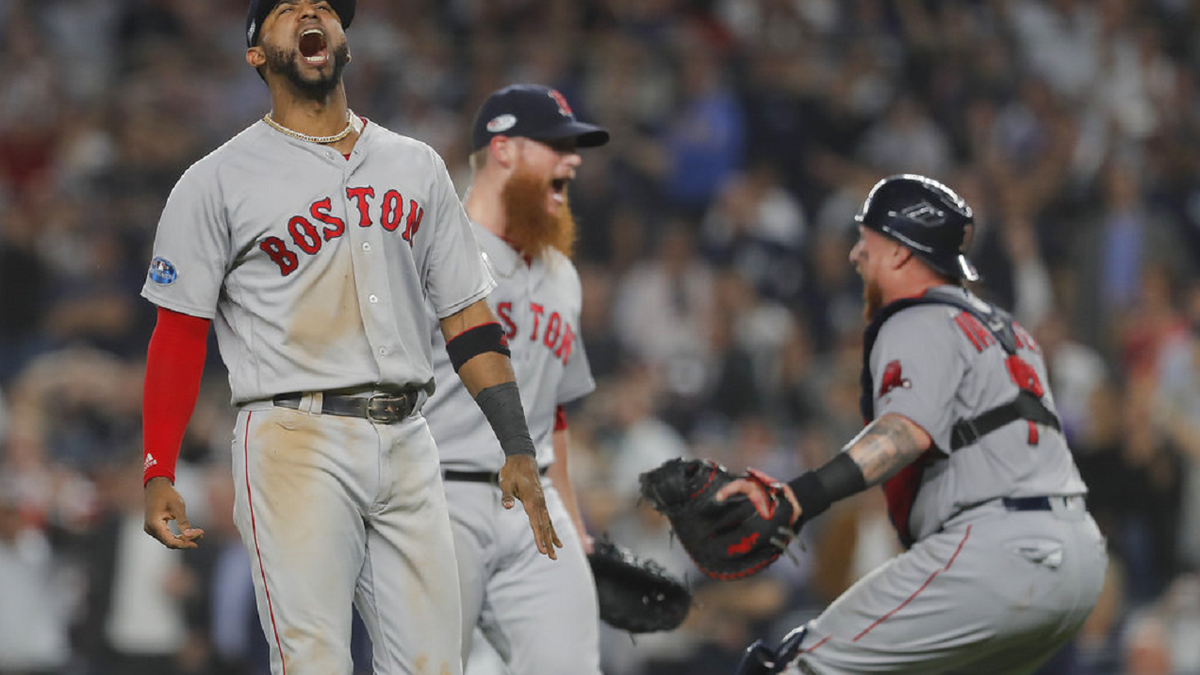 FILE: Boston Red Sox third baseman Eduardo Nunez, left, celebrates with teammates after the Red Sox victory in New York.