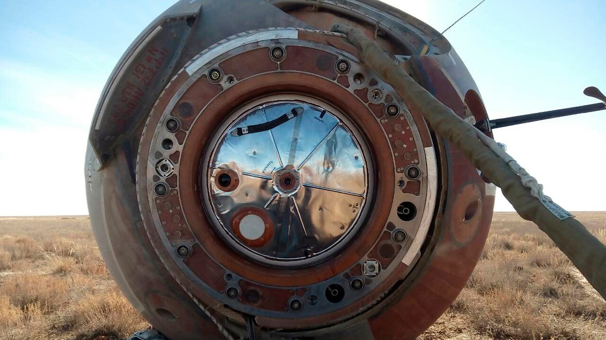 In this photo provided by Russian Defense Ministry Press Service, the Soyuz MS-10 space capsule lays in a field after an emergency landing near Dzhezkazgan, about 450 kilometers (280 miles) northeast of Baikonur, Kazakhstan, Thursday, Oct. 11, 2018. NASA astronaut Nick Hague and Roscosmos' Alexei Ovchinin lifted off as scheduled at 2:40 p.m. (0840 GMT; 4:40 a.m. EDT) Thursday from the Russian-leased Baikonur cosmodrome in Kazakhstan, but their Soyuz booster rocket failed about two minutes after the launch.