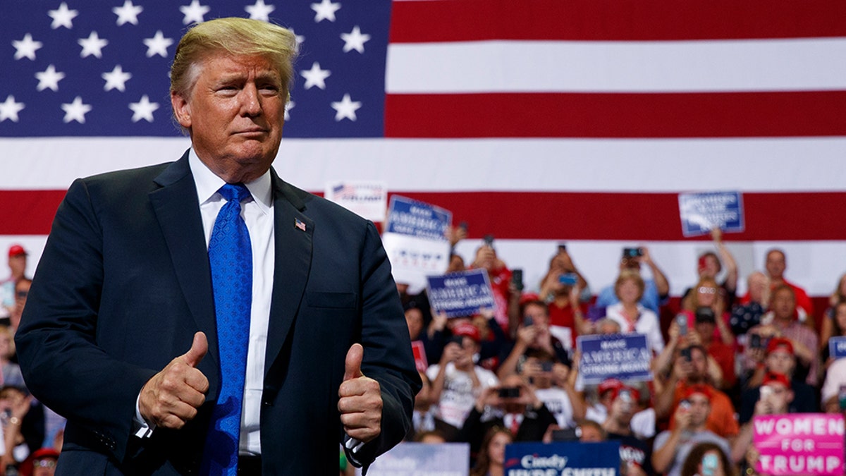 Trump gives thumbs up at a rally