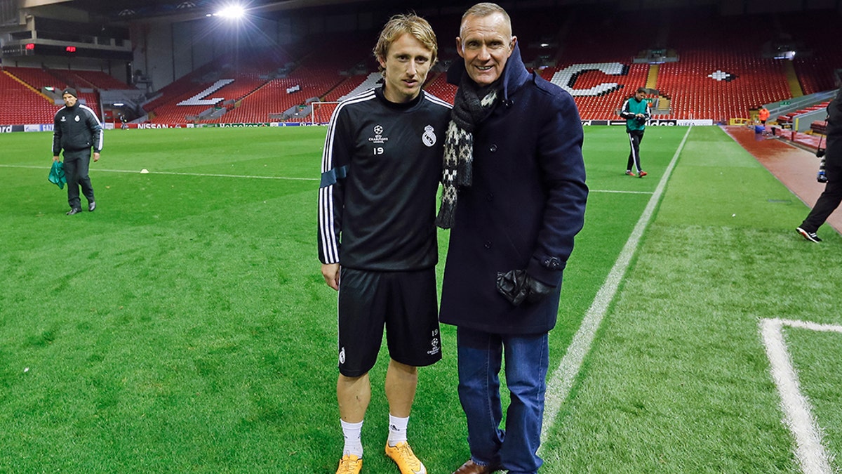 Terry Nelson poses with Real Madrid soccer star Luka Modric; Madrid are one of the European soccer teams who have used the suits