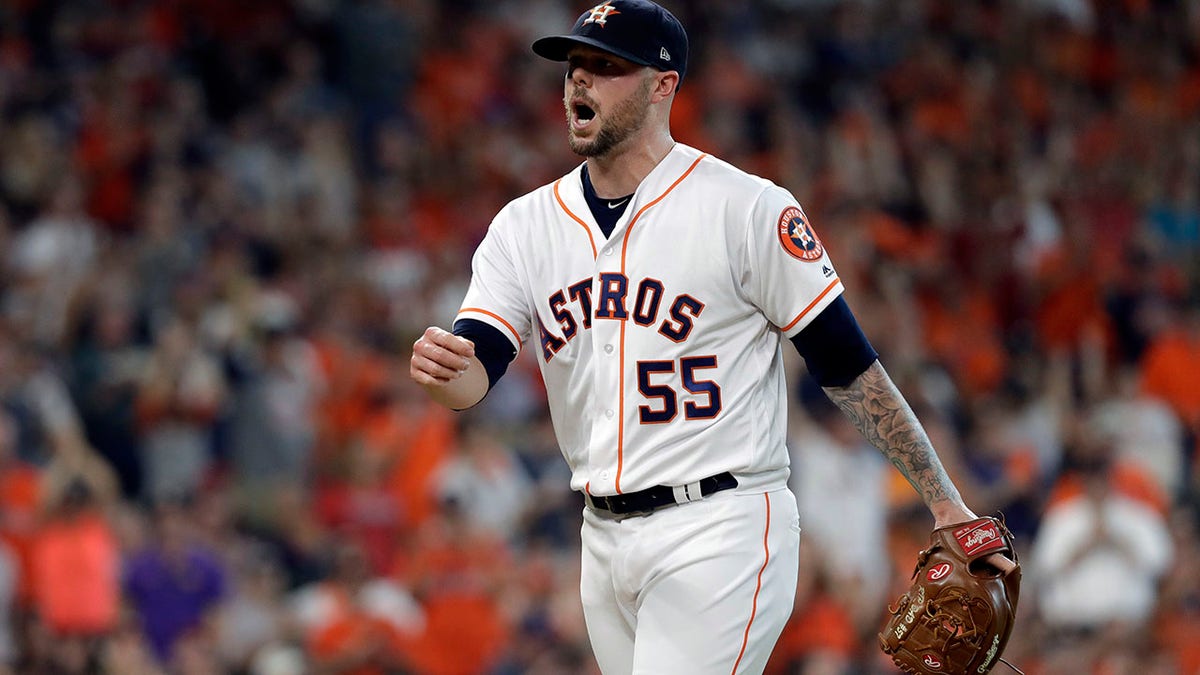 Houston Astros pitcher Ryan Pressly reacts after fielding a ground ball by Cleveland Indians Melky Cabrera and making the out during the seventh inning in Game 1 of the American League Division Series, in Houston, Oct. 5, 2018.