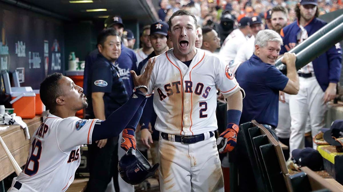 Houston Astros' Alex Bregman (2) celebrates after hitting a solo home run against Cleveland Indians pitcher Trevor Bauer during the seventh inning of Game 2 of the American League Division Series, in Houston, Oct. 6, 2018.