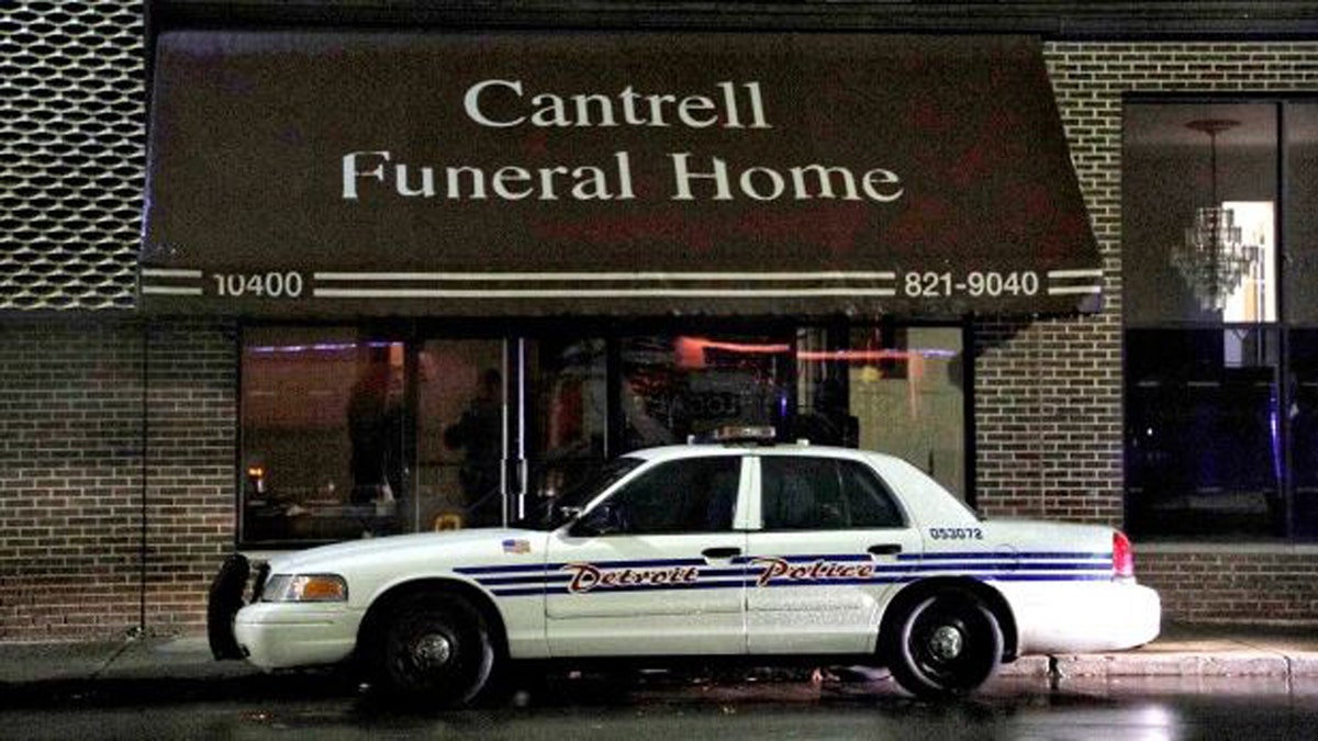 A Detroit Police vehicle is parked outside the Cantrell Funeral Home in Detroit on Friday, Oct. 12, 2018. 