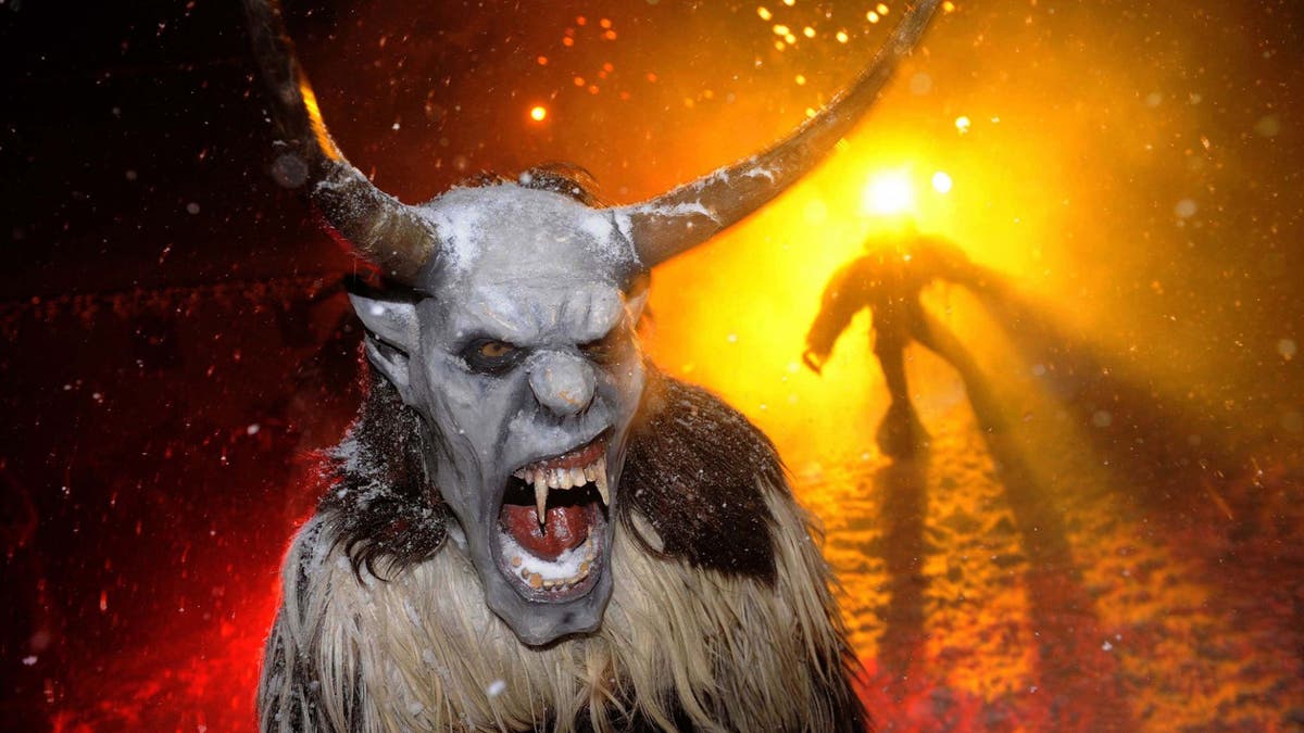 File photo - Actors dressed as devils perform during the "gathering of the devils" ahead of Saint Nicholas Day in Podkoren December 1, 2010. (REUTERS/Bor Slana)