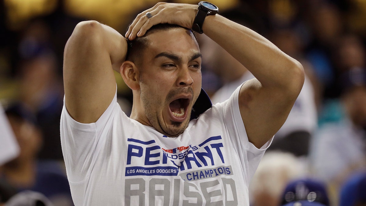 A fan yawns before the start of the 17th inning in Game 3 of the World Series baseball game between the Boston Red Sox and Los Angeles Dodgers on Friday in Los Angeles.