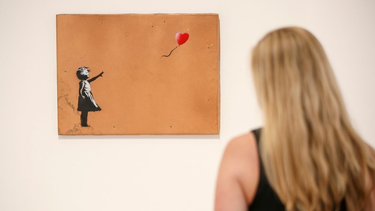 The "Girl With Balloon" by Banksy seen here at the Lazinc Gallery in London on July 11, 2018.