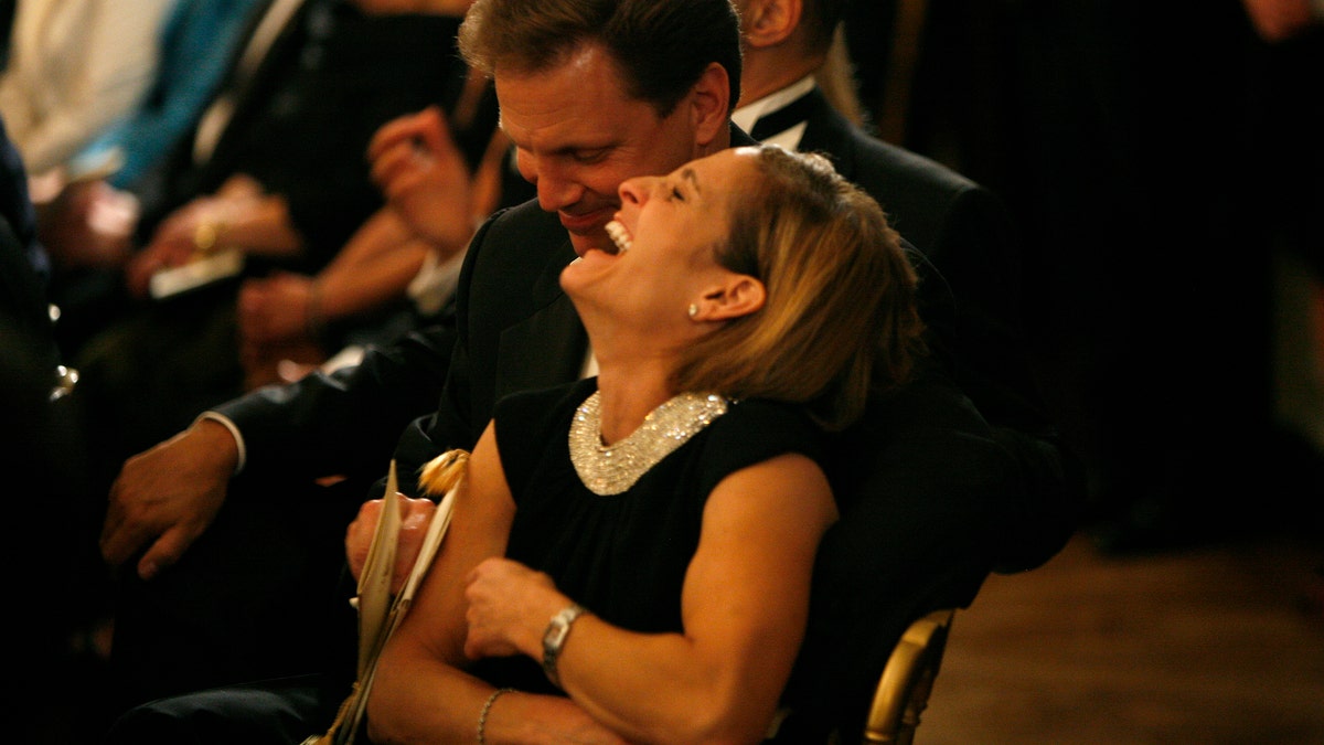 Mary-Lou Retton Kelley and her husband Shannon Kelley laugh during a performance by the Jersey Boys following a dinner hosted by President George W. Bush and first lady Laura Bush for Italian Prime Minister Silvio Berlusconi at the White House October 13, 2008 Washington DC. Columbus Day was being celebrated today in the U.S.