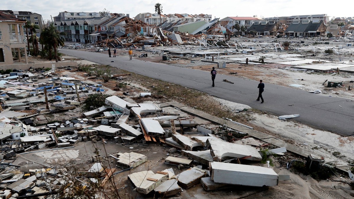 Rescue personnel search amidst debris in the aftermath of Hurricane Michael in Mexico Beach, Fla.