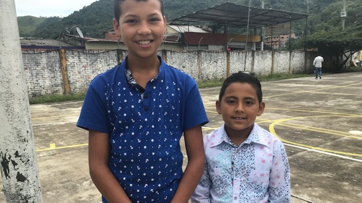 Coscuez locals Edison, 12 and Daniel, 8 ahead of English languages lessons.