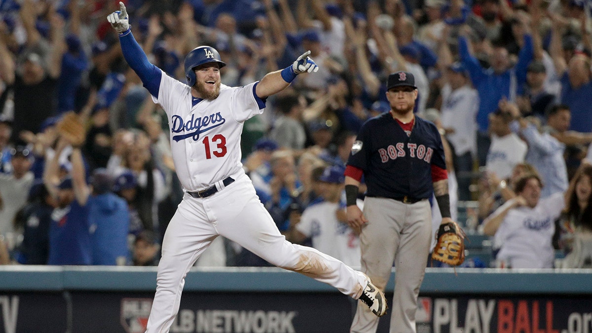 Los Angeles Dodgers' Max Muncy celebrates after his walk-off home run against the Boston Red Sox in the 18th inning of Game 3 of the World Series, on Saturday, Oct. 27, 2018, in Los Angeles. (Associated Press)