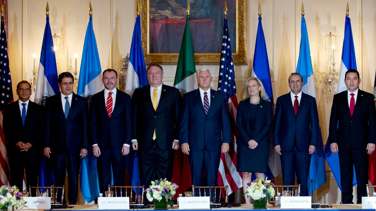 From left; Vice President Oscar Ortiz of El Salvador, Honduran President Juan Orlando Hernandez, Mexico Foreign Secretary Luis Videgaray, U.S. Secretary of State Mike Pompeo, Vice President Mike Pence, Secretary of Homeland Security Kirstjen Nielsen, Mexico Secretary of Government Alfonso Navarrete and Guatemalan President Jimmy Morales pose for a photos before the second Conference for Prosperity and Security in Central America at State Department on Thursday.