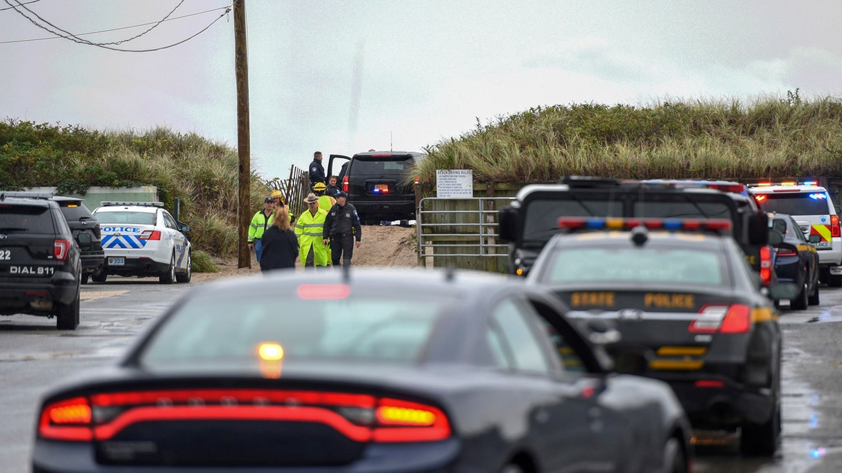 First responders gather on a beach in Quogue, on Long Island, New York, following reports of a plane crashing into the Atlantic on Saturday.