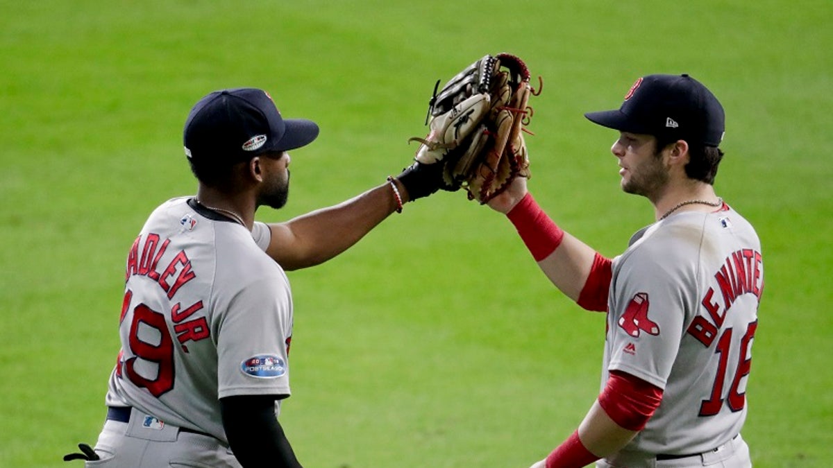 Boston Red Sox center fielder Jackie Bradley Jr., left, and left fielder Andrew Benintendi. The Red Sox have taken the series lead against the Houston Astros.