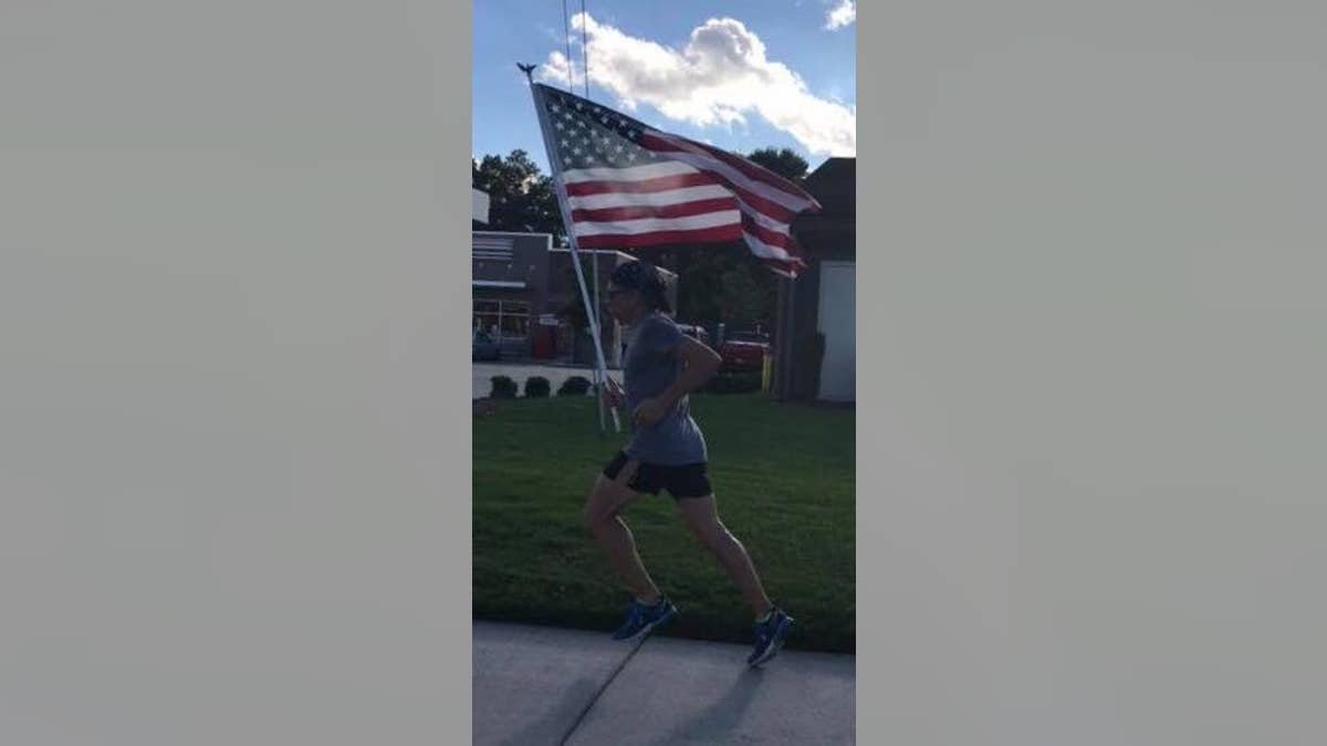 Parfitt said his favorite aspect of running with the flag is holding it "high and proud."