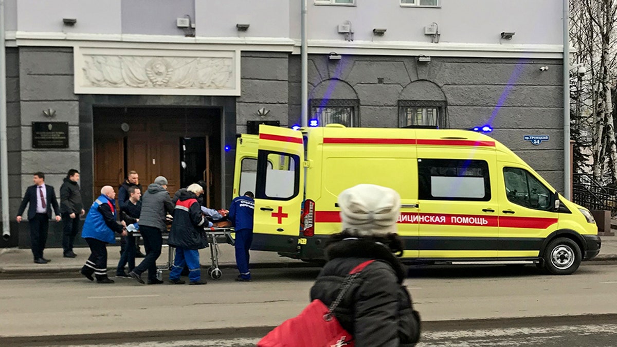 An ambulance carries a casualty after an explosion at the entrance of an FSB office in the city of Akhangelsk, in northern Russia.