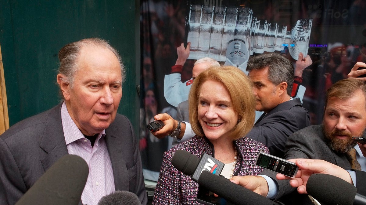 David Bonderman, left, of Seattle Hockey Partners, and Seattle Mayor Jenny Durkan talk to reporters as they leave a meeting at National Hockey League headquarters in New York City, Oct. 2, 2018.