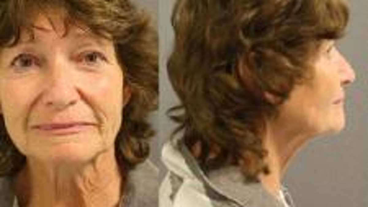 Linda Dwire, 64, was arrested on a harassment charge on Monday. She was captured on video in a verbal confrontation with another shopper defending two Spanish-speaking women.
