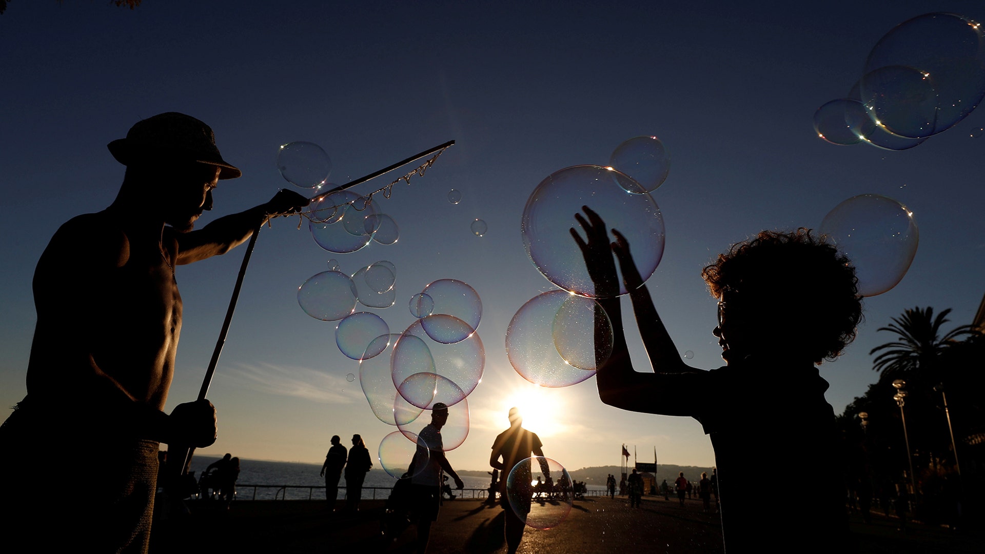 A street artist performs during a warm and sunny autumn day on the Promenade des Anglais in Nice, France, Oct. 24, 2018. 