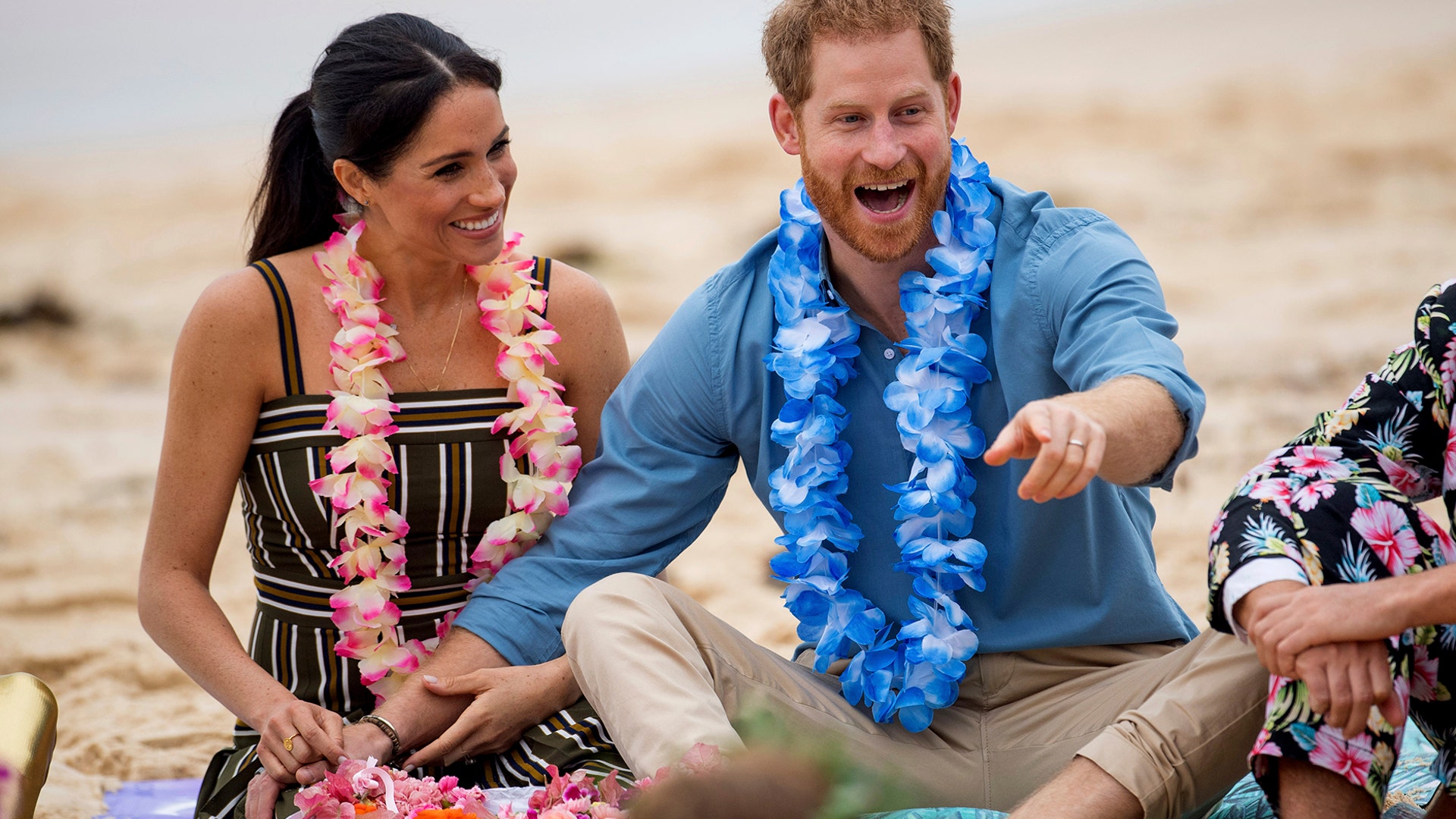 Britain's Prince Harry and Meghan, Duchess of Sussex meet with a local surfing community group, known as OneWave, at Bondi Beach in Sydney, Australia, Oct. 19, 2018.  