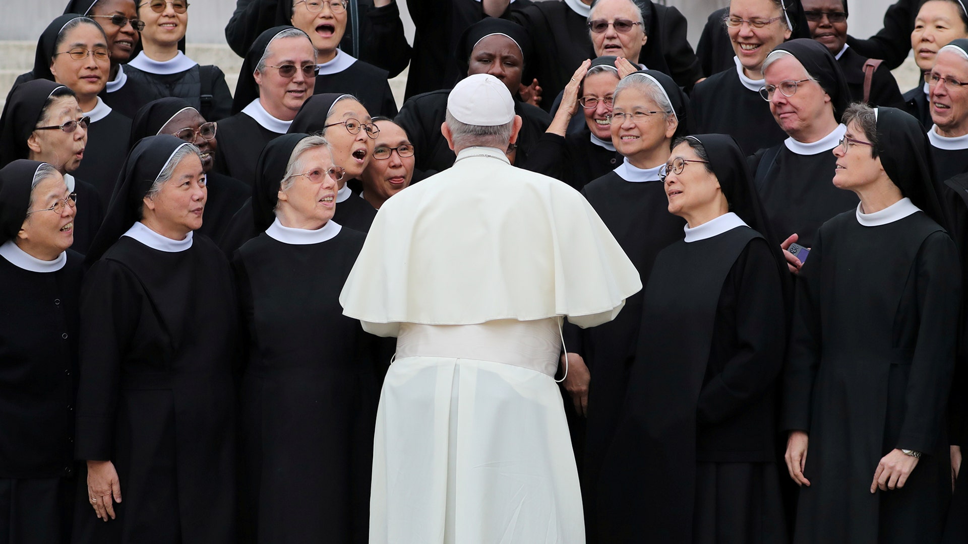 Pope Francis talks with nuns after the weekly general audience in Saint Peter's Square at the Vatican, Oct. 17, 2018. 