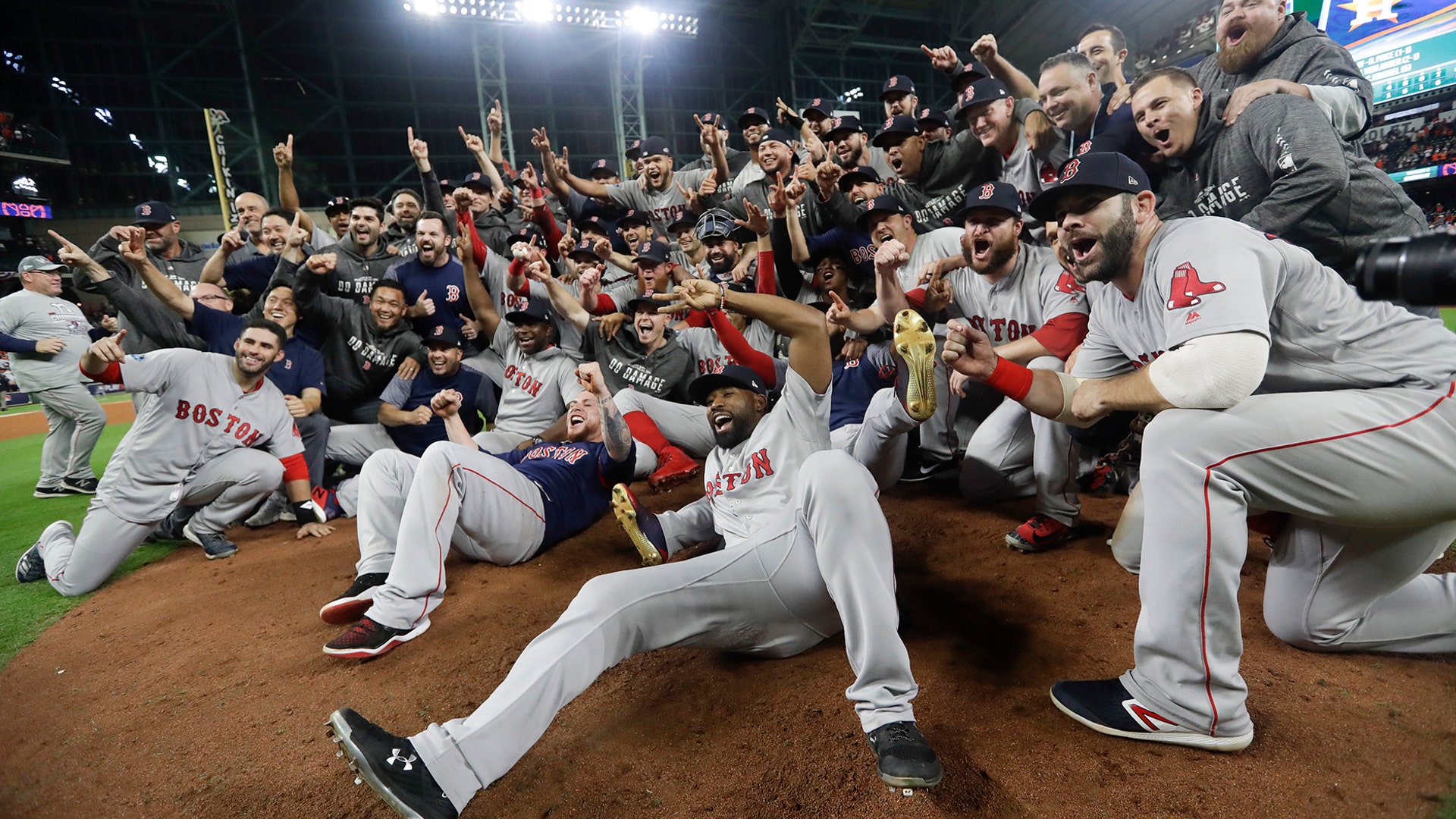 The Boston Red Sox pose for a picture after winning the American League Championship Series against the Houston Astros in Houston, Oct. 18, 2018.
