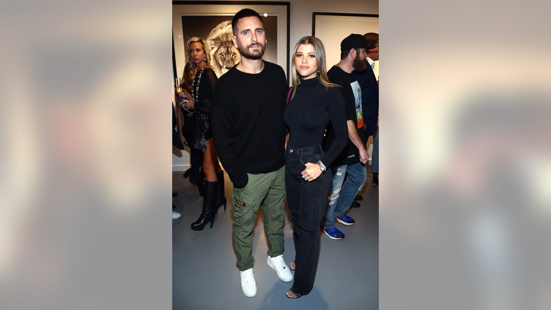 Scott Disick and Sophia Richie kept close at the VIP opening of Maddox Gallery LA in West Hollywood, Calif. on October 11, 2018.