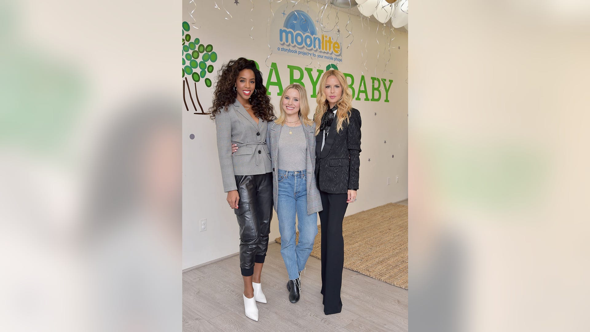 (From left) Kelly Rowland, Kristen Bell, and Rachel Zoe hang out at the "Moonlite and Baby2Baby Storytime Playdate" event held at the Baby2Baby headquarters in Los Angeles, Calif. on October 11, 2018.