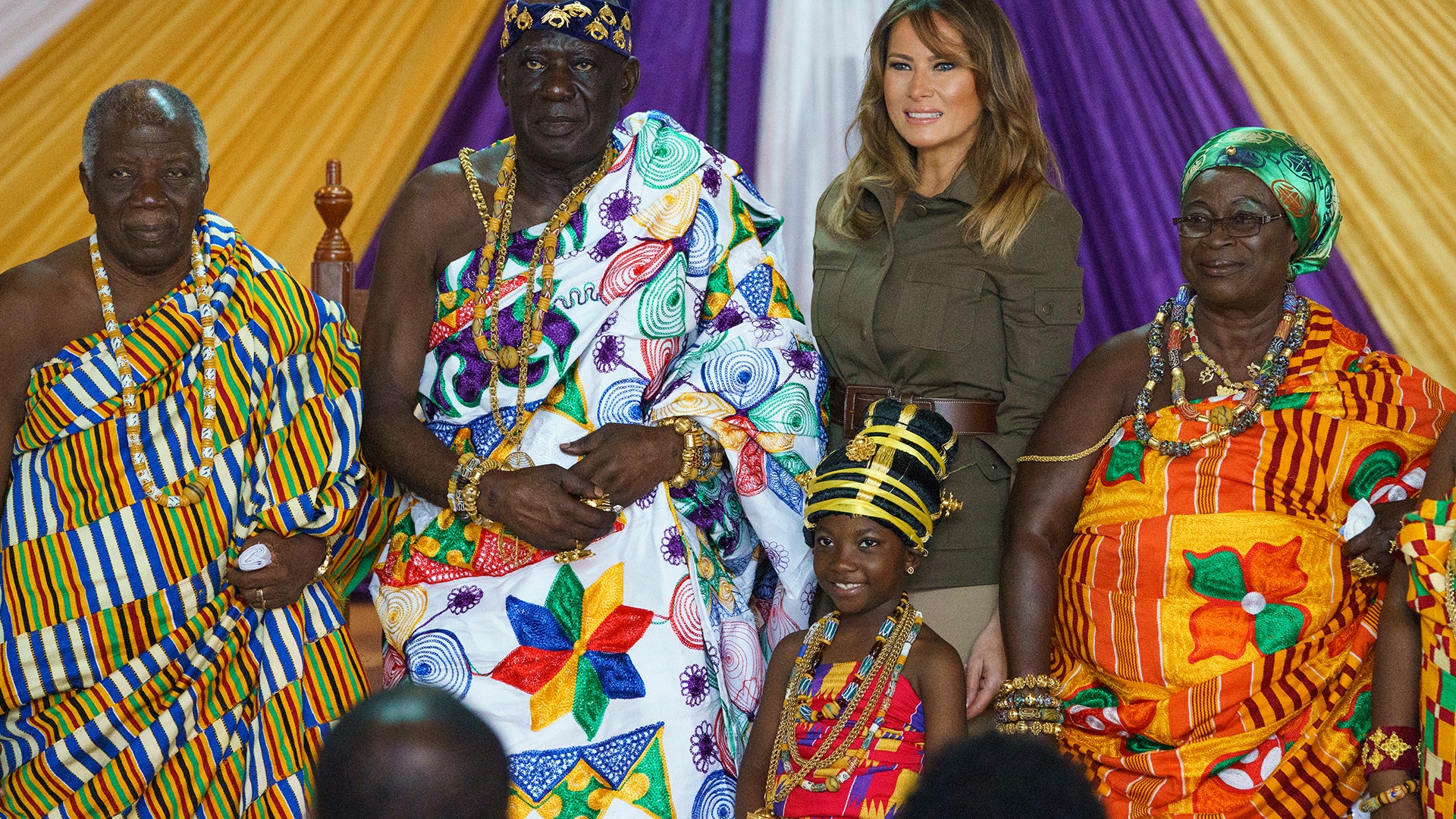 First lady Melania Trump, second from right, and Osabarimba Kwesi Atta II, the chieftain of the Cape Coast Fante, second from left, and others pose for photographs during a cultural ceremony at the Emintsimadze Palace in Cape Coast, Ghana, Wednesday, Oct. 3, 2018. (AP Photo/Carolyn Kaster)