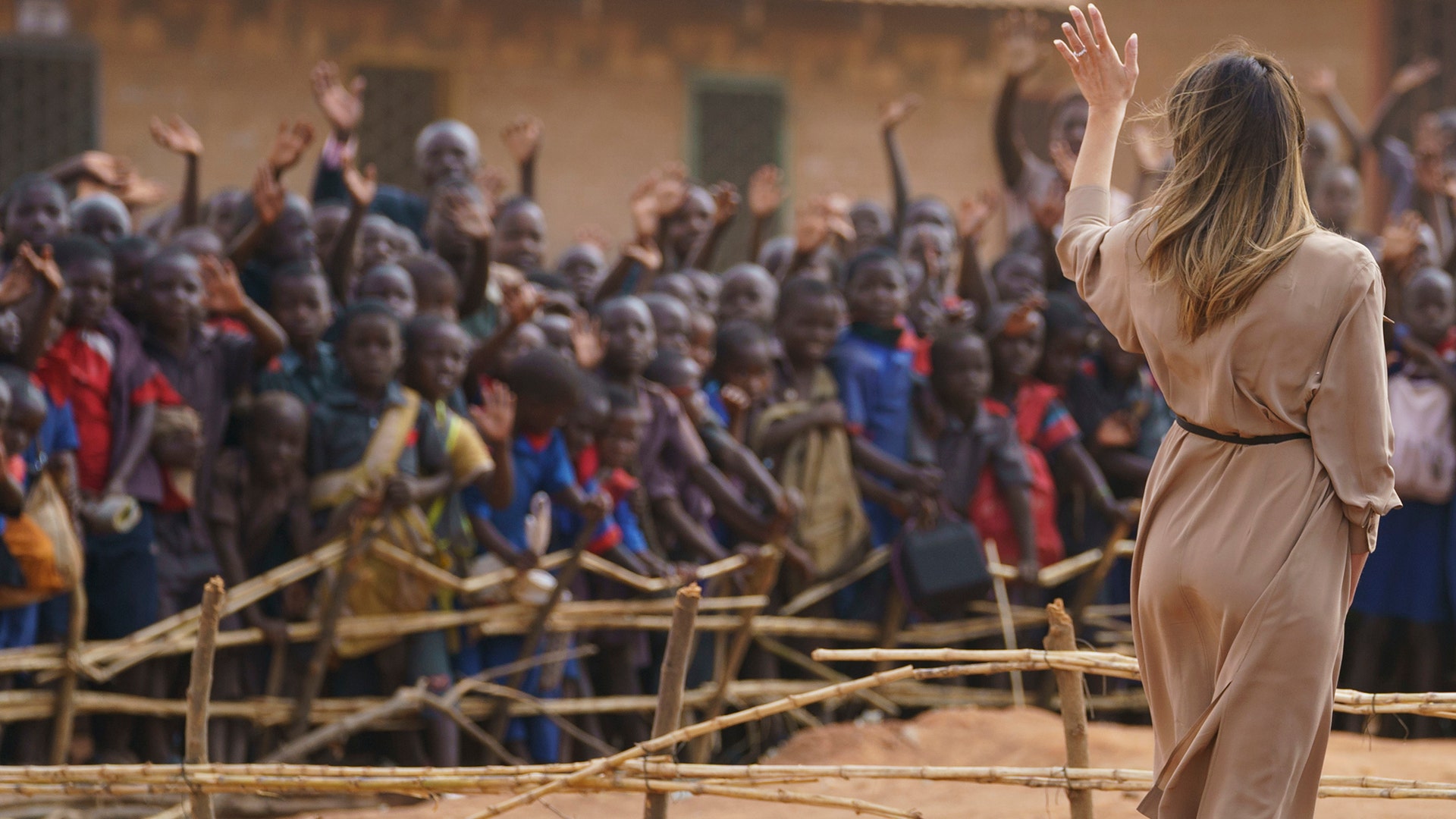 First lady Melania Trump waves to children and others as she visits Chipala Primary School, in Lilongwe, Malawi, Thursday, Oct. 4, 2018.  (AP Photo/Carolyn Kaster)