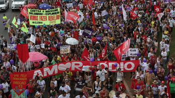 Thousands rally against leading, far-right Brazil candidate