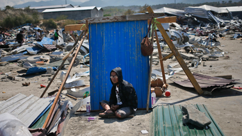 The Latest: President arrives in hard-hit city to see damage