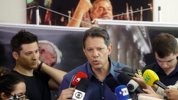 Brazil candidate says far-right poll leader smears to rise