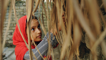 AP PHOTOS: Girl child day: Ansa, 10, starts day with prayer