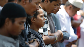 Muslims pray for strength in quake-hit Indonesian city